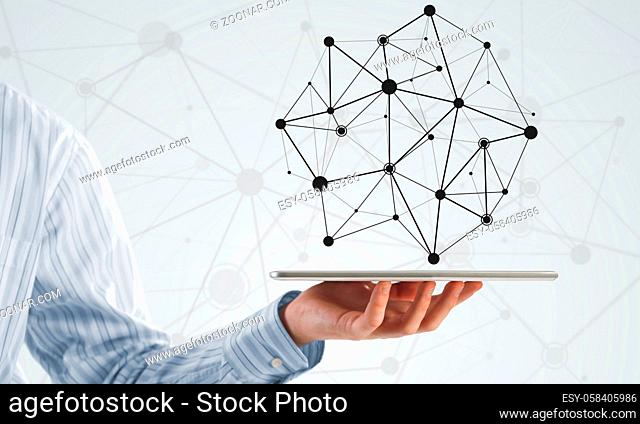 Hand of businessman showing tablet pc as concept of global connectivity
