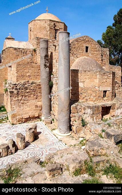 the historic church of yia Kyriaki Chrysopolitissa in paphos cyprus showing the building and the surrounding old roman columns and ruins