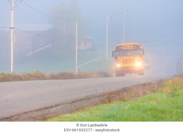 School bus on an early foggy morning, Stowe, Vermont, USA