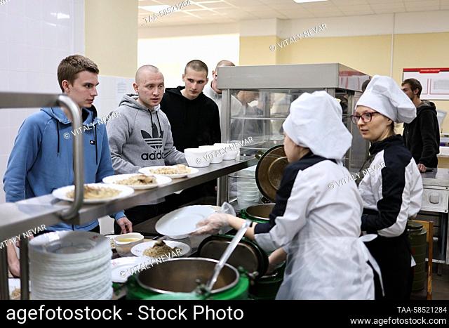 RUSSIA, KALININGRAD - APRIL 19, 2023: Young men queue to have a meal in the mess room of an assembly station for conscripts of the regional army recruitment...
