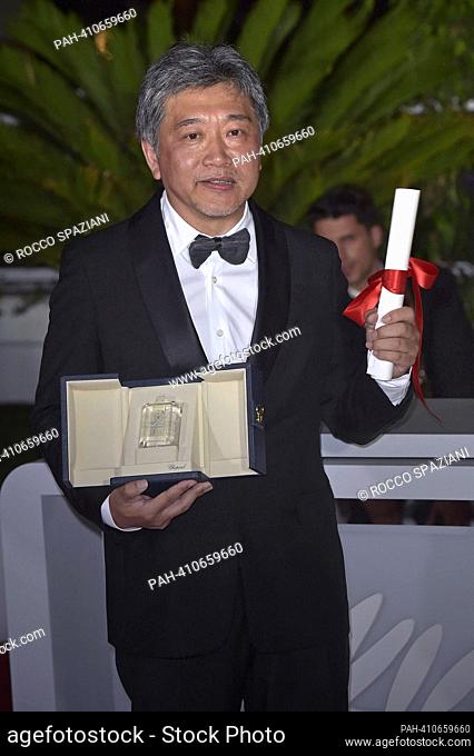 CANNES, FRANCE - MAY 27: Hirokazu Koreeda poses with the The Award for Best Screenplay for Kaibutsu (Monster) during the Palme D'Or winners photocall at the...