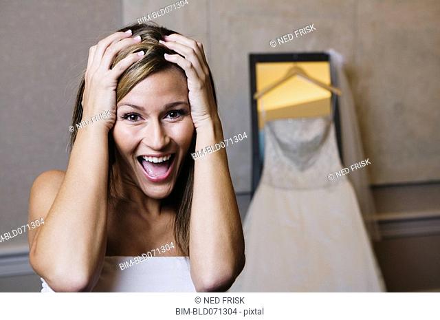 Bride yelling with hands on head