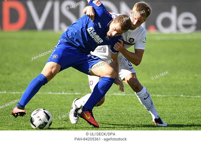 Karlsruhe's Charalampos Mavrias (L) and Aue's Sebastian Hertner vie for the ball the German 2nd Bundesliga soccer match between Karlsruher SC and FC Erzgebirge...