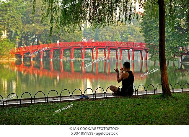 early morning exercises beside Hoan Kiem Lake, Hanoi, Vietnam