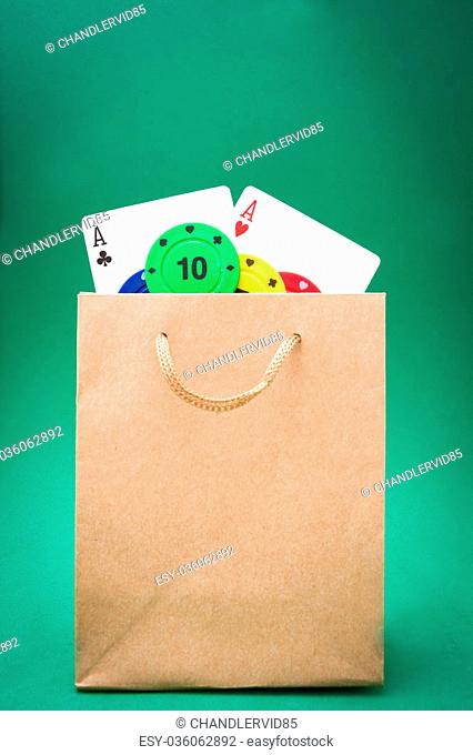 cardboard bag with poker cards and poker chips