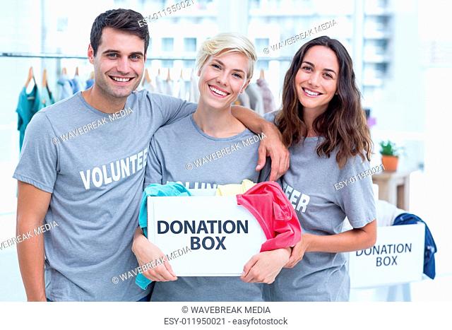 Volunteers friends holding a donation box