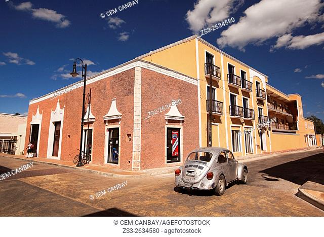 Scene from the historic center with colorful colonial buildings in the foreground, Valladolid, Yucatan Province, Mexico, Central America