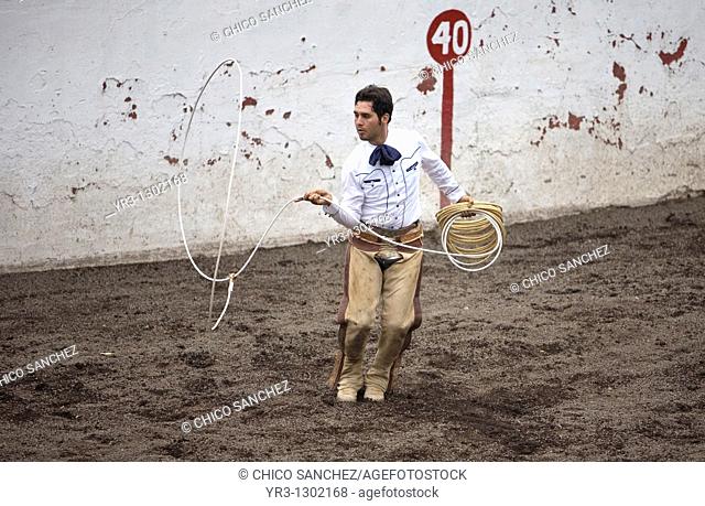 A Mexican charro practices his lasso in Mexico City, August 17, 2008  Male rodeo competitors are 'Charros, ' from which comes the word 'Charreria ' Charreria is...
