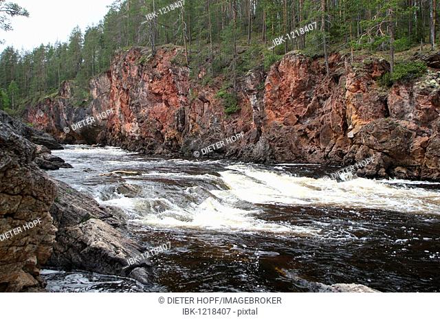 Red granite rocks in the rapids of the Oulankajoki river Oulanka in National Park, Lapland, Finland, Europe