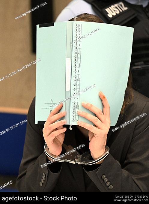 06 December 2023, Baden-Württemberg, Mannheim: The defendant in the trial for the alleged murder of her two children waits in a courtroom at Mannheim District...