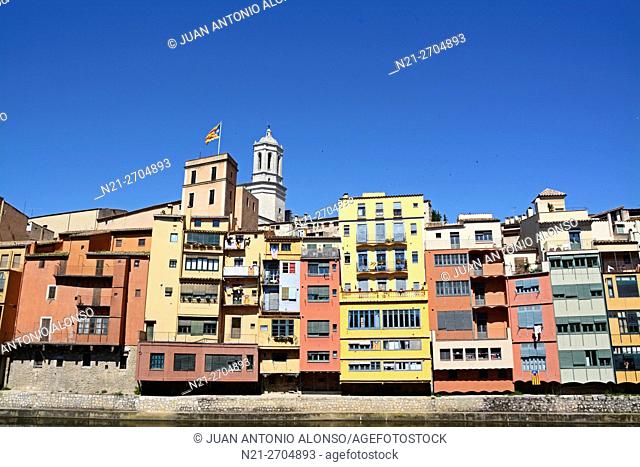 Buildings on the Onyar River. In the background the tower of the cathedral stands out. City of Girona, Catalonia, Spain, Europe