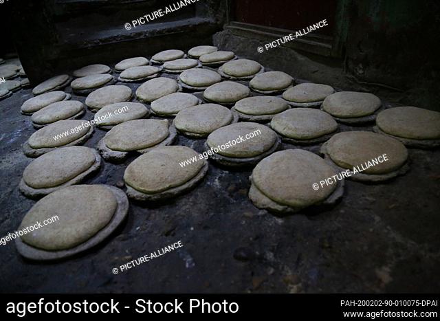 29 January 2020, Egypt, Manfalut: A picture provided on 02 February 2020 shows spheres of Sun Bread dough lying on the ground to rise before baking at the ""Al...