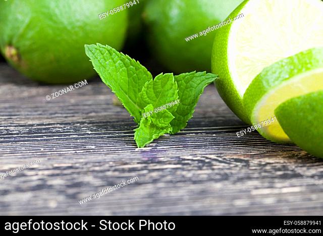 sliced green lime with a mint leaf during cooking