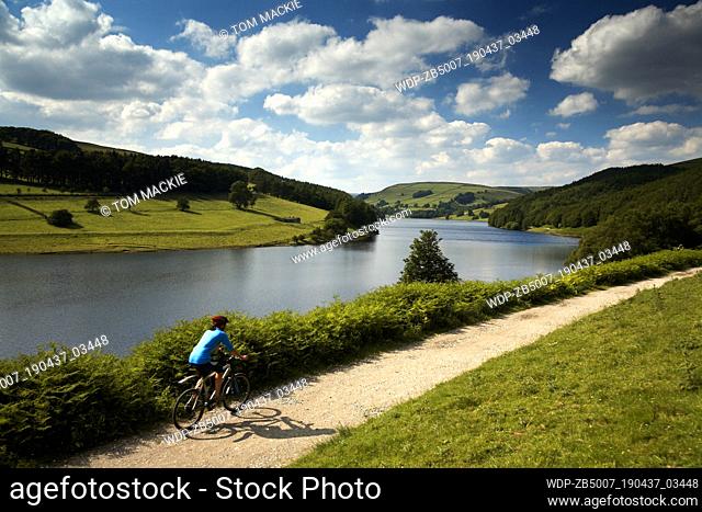 Mountain biker by Derwent Water, Peak District National Park, Derbyshire, England