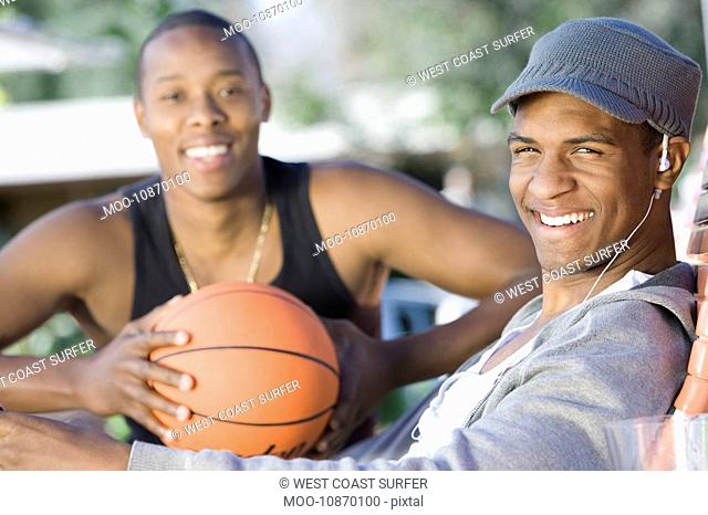 Two Young Men with Basketball Portrait