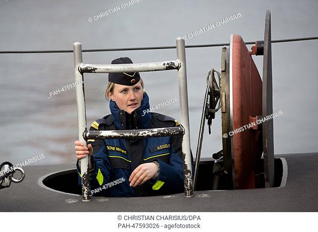 Lieutenant Janine Asseln goes aboard the submarine U-32 at the port of the Naval Base in Eckernfoerde, Germany, 02 April 2014