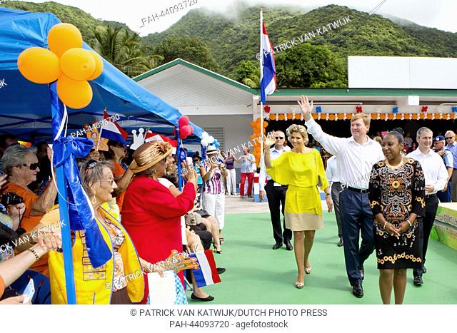 King Willem-Alexander and Queen Maxima of The Netherlands visit the Juliana Sports Field on the island of Saba, 14 November 2013