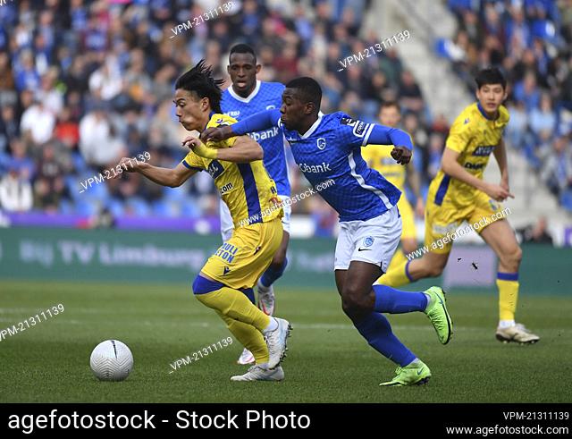 STVV's Daichi Hayashi and Genk's Carlos Cuesta fight for the ball during a soccer match between KRC Genk and Sint-Truidense VV, Sunday 13 March 2022 in Genk