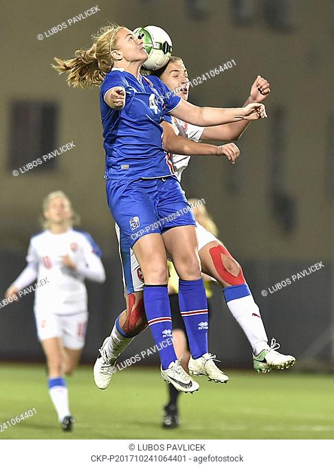 Glodis Viggosdottir of Iceland, front, and Tereza Kozarova of Czech in action during the women's World Cup qualification soccer match between Germany and...