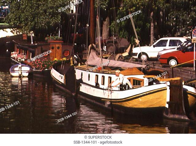 Boats docked in a canal, Brouwersgracht, Amsterdam, Netherlands