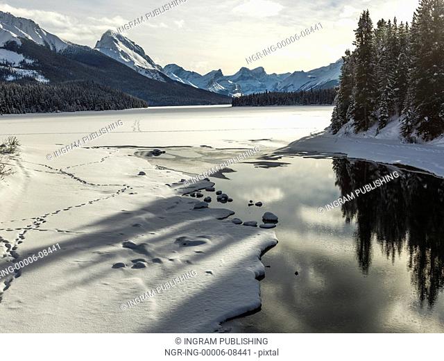 View of snow covered lake, Improvement District No. 12, Maligne Lake, Jasper, Jasper National Park, Alberta, Canada