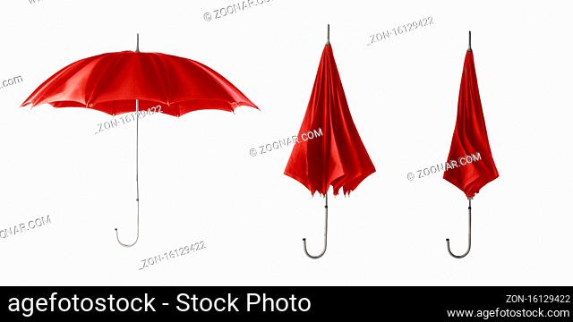 Three red retro umbrellas. Open umbrella step