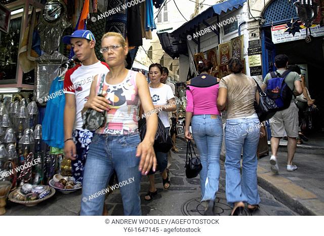 Shoppers in narrow lane Medina Tunis Tunisia