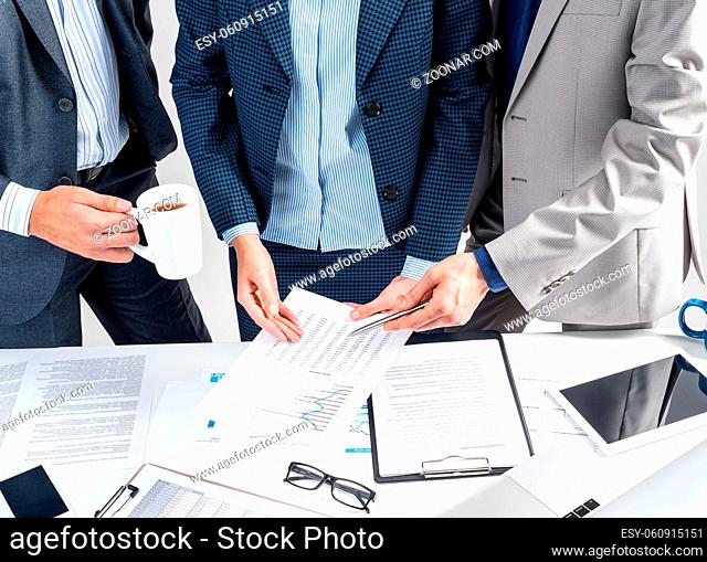 Business partnership concept with business people. Office desk with financial analytics. Business meeting in conference hall
