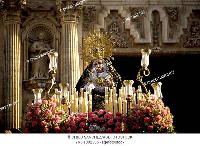 A wooden sculpture of the Virgin Mary is carried out of the church during an Easter Holy Week procession in the town of Arcos de la Frontera in southern Spain's...