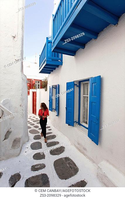 Woman walking in Chora near Little Venice, Mykonos, Cyclades Islands, Greek Islands, Greece, Europe