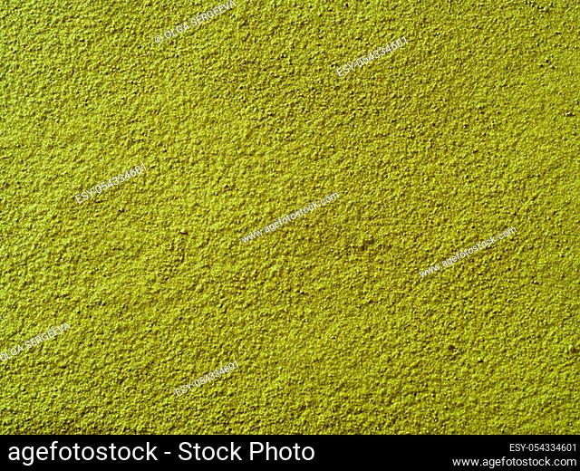 Powdered matcha green tea background. Close up. Dry green maccha powder tea with copy space for text or design