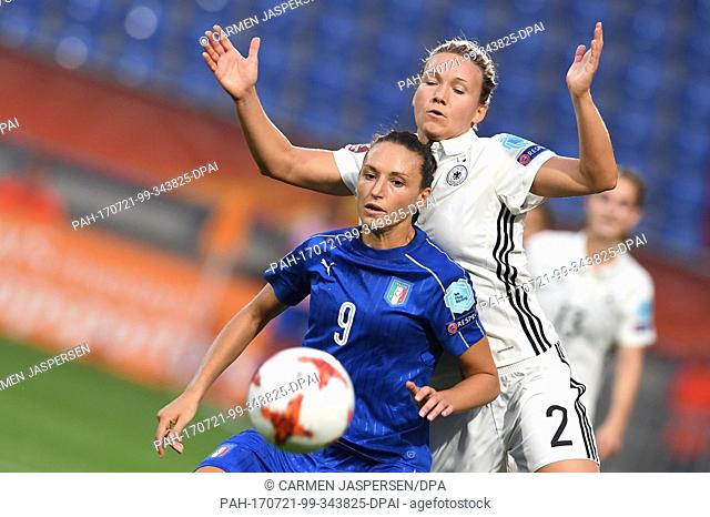 Germany's Josephine Henning (R) and Ilaria Mauro from Italy vie for the ball during the women's European Soccer Championships group B match between Germany and...