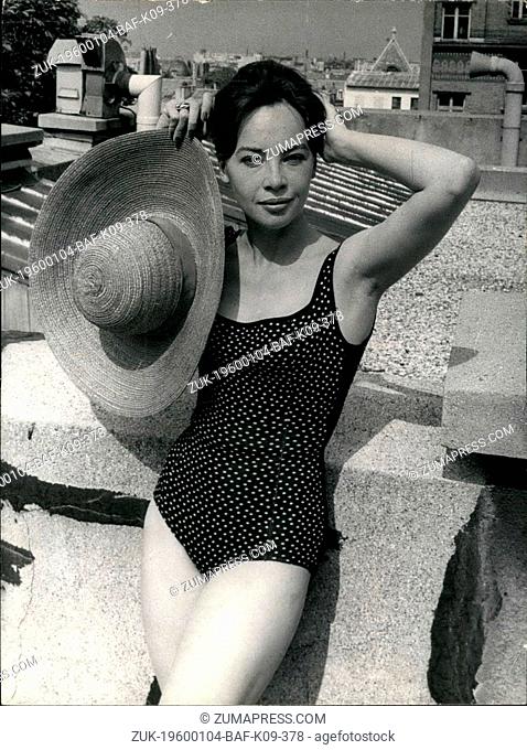 1962 - Sunbathing on the Rooftops of Paris for Leslie Caron. Seen on the rooftops of Paris, under a hot August sky, clad most fetchingly for sunbathing