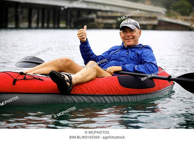 ECO-TOURIST aboard an INFLATABLE KAYAK in the water of ELKHORN SLOUGH - MOSS LANDING, USA, California