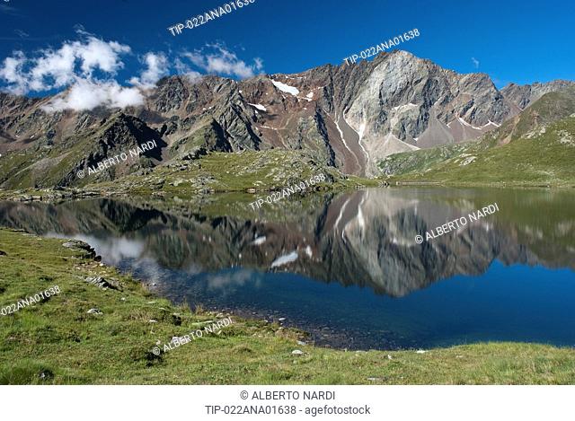 Italy, Lombardy, Stelvio National Park, Nero Lake near Gavia Pass, Pietra Rossa peak on background