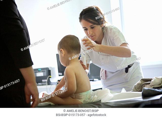 Reportage in the pediatric emergency unit in a hospital in Haute-Savoie, France. A nurse takes a young boy's temperature