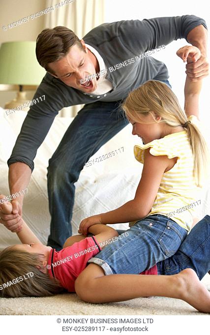 Children Fighting In Front Of Father At Home