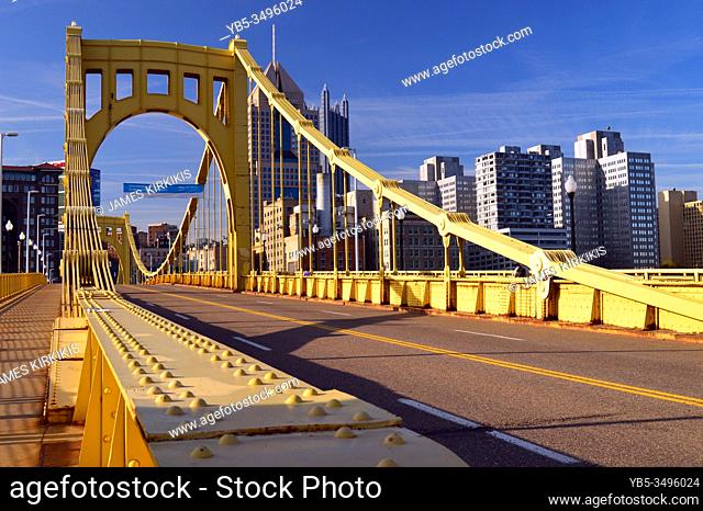 The yellow Sixth Street Bridge leads travelers into downtown Pittsburgh, Pennsylvania