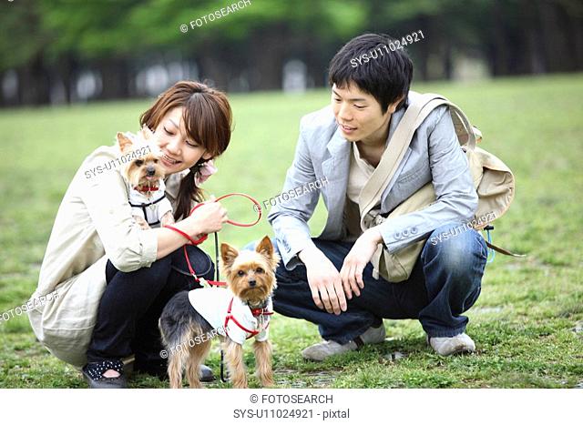 Couple taking a walk with the dog