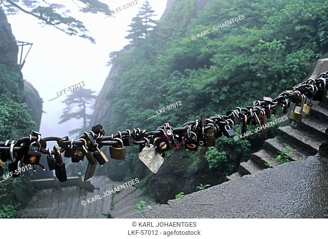 padlocks, locked and the key thrown down the mountain, symbol for couples to pledge faithfulness, mountain, Huang Shan, Anhui province, China, Asia