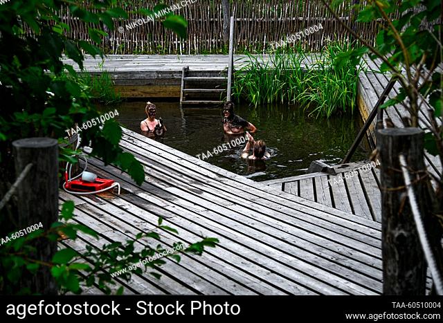 RUSSIA, SAKHALIN REGION - JULY 17, 2023: Tourists visit the Zharkiye Vody [Hot Waters] health resort on Iturup, the largest island of the Greater Kuril Chain