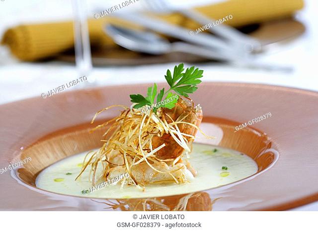 Soup of leek cream with sauteed crayfish