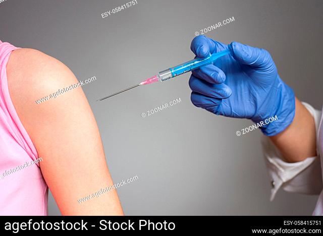 Vaccination concept, doctor is preparing to vaccinate the patient