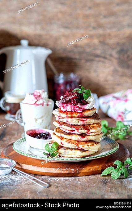 Pancakes with cream cheese and cherries