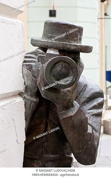 Slovakia, Bratislava, Laurinska, Historic neighborhood, a paparazzi sculpture in front of an Italian restaurant also called Paparazzi