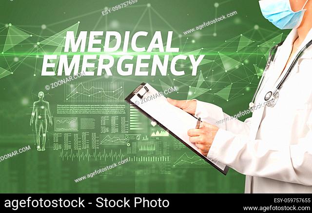 doctor writes notes on the clipboard with MEDICAL EMERGENCY inscription, medical diagnosis concept