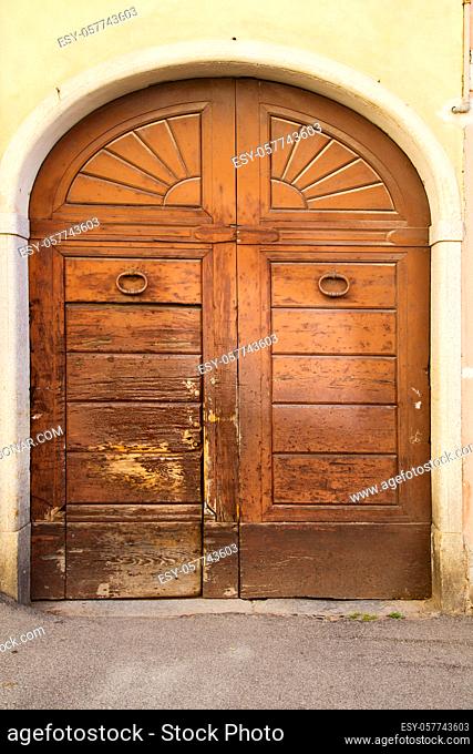 vedano olona italy  church varese the old door entrance and mosaic sunny daY