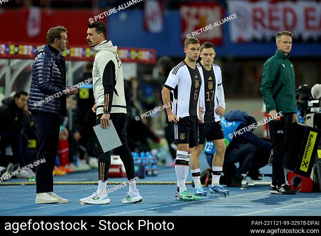 21 November 2023, Austria, Wien: Soccer: International match, Austria - Germany, Ernst-Happel-Stadion. Germany's Joshua Kimmich (2nd from left) and Germany's...
