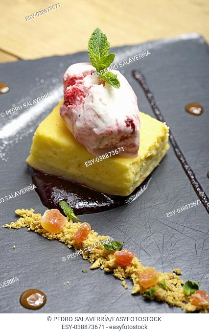 Cheesecake with red fruit and ice cream