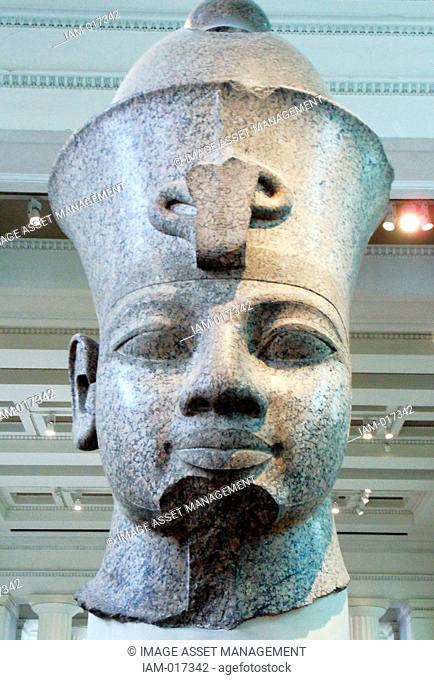King Amenhotep III (1390-1352 BC) , Red granite head from the temple of Mut, Karnak, Egypt. 18th Dynasty, around 1350 BC